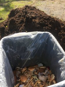 trash can of food waste and compost